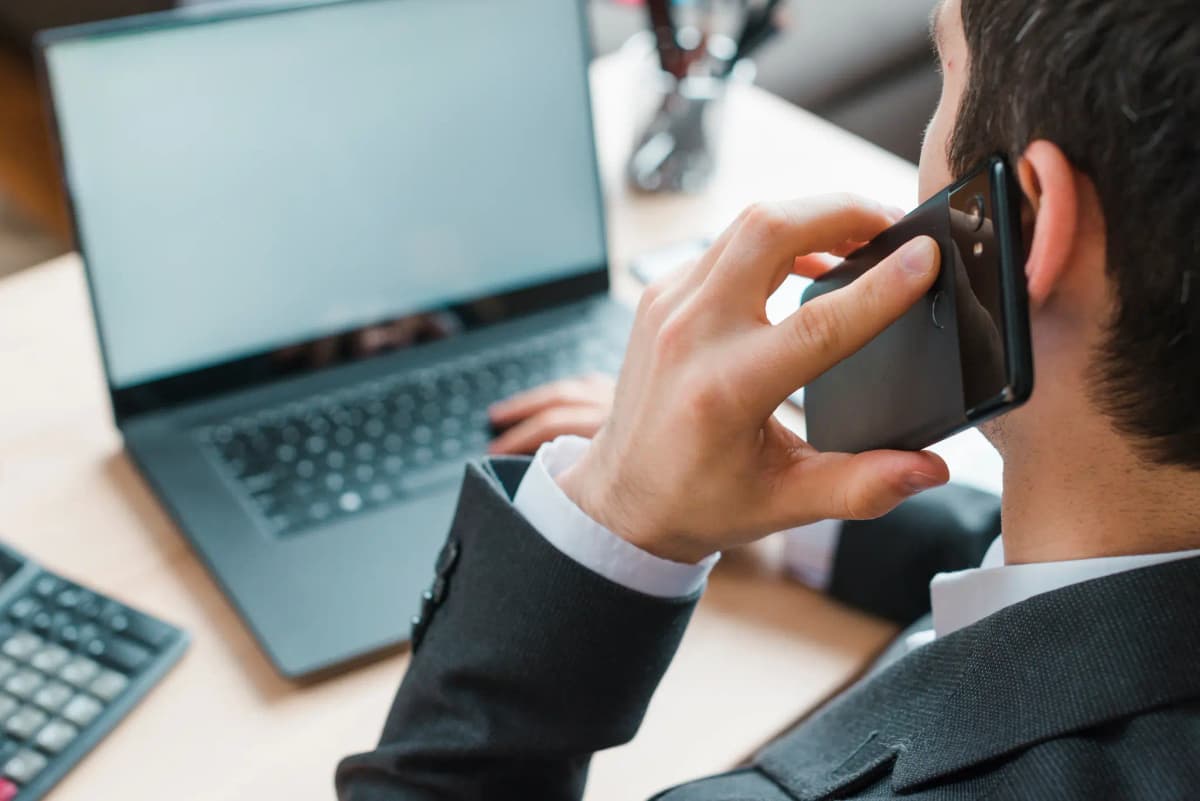 Oikro contact us - person on a business call